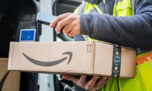 Cropped shot of an Amazon Prime delivery agent scanning barcodes on boxes during his work shift